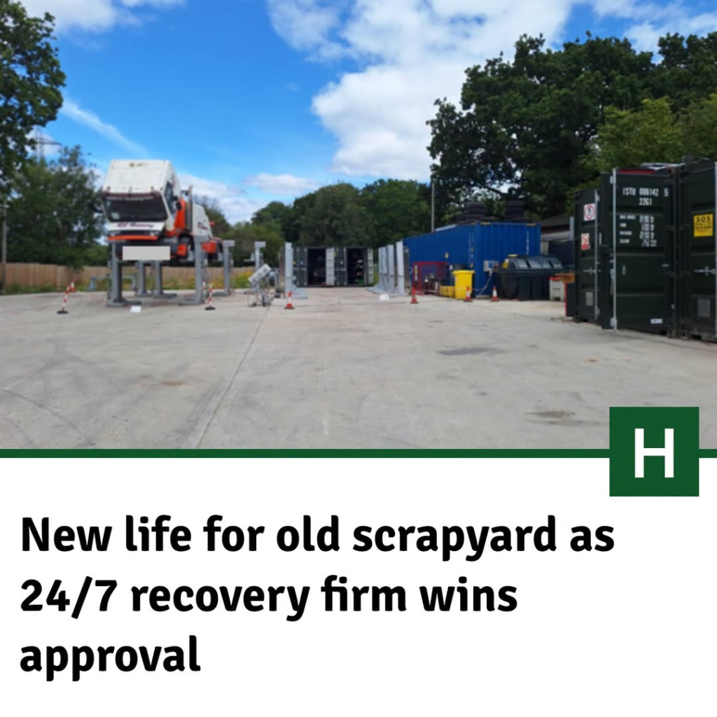 Scrapyard with truck and shipping containers, now a 24/7 vehicle recovery firm.