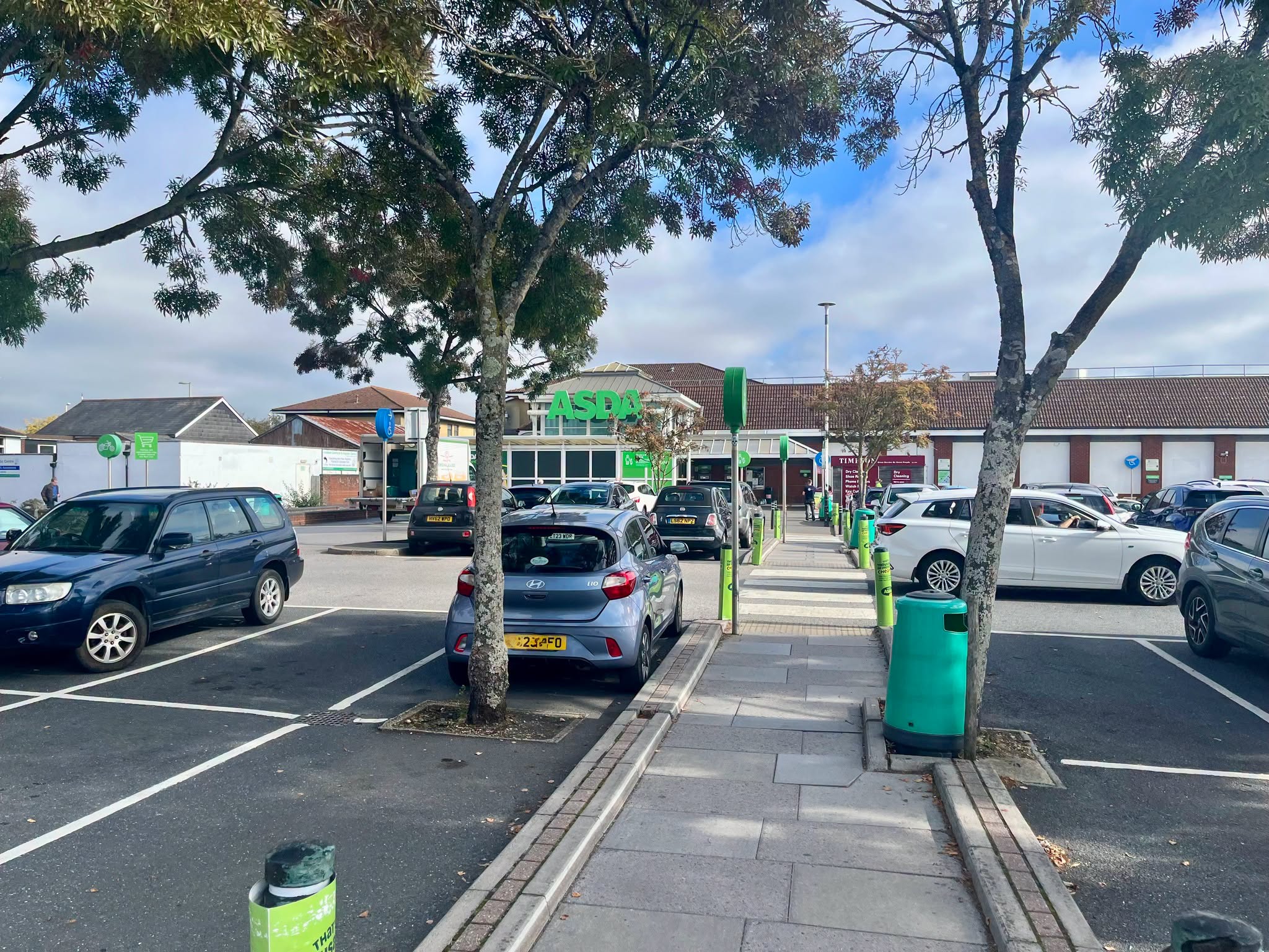 Asda supermarket entrance with cars in the parking lot
