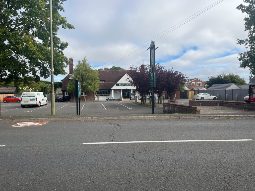 The Testwood pub exterior with parking and cars