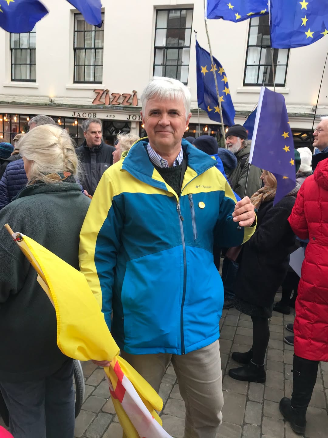 Man holding EU flag at a conservative protest