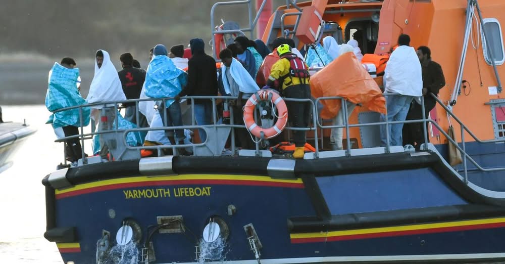 People wrapped in blankets on the Yarmouth lifeboat