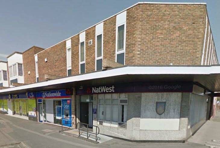 NatWest and Nationwide banking hub storefronts with ATMs