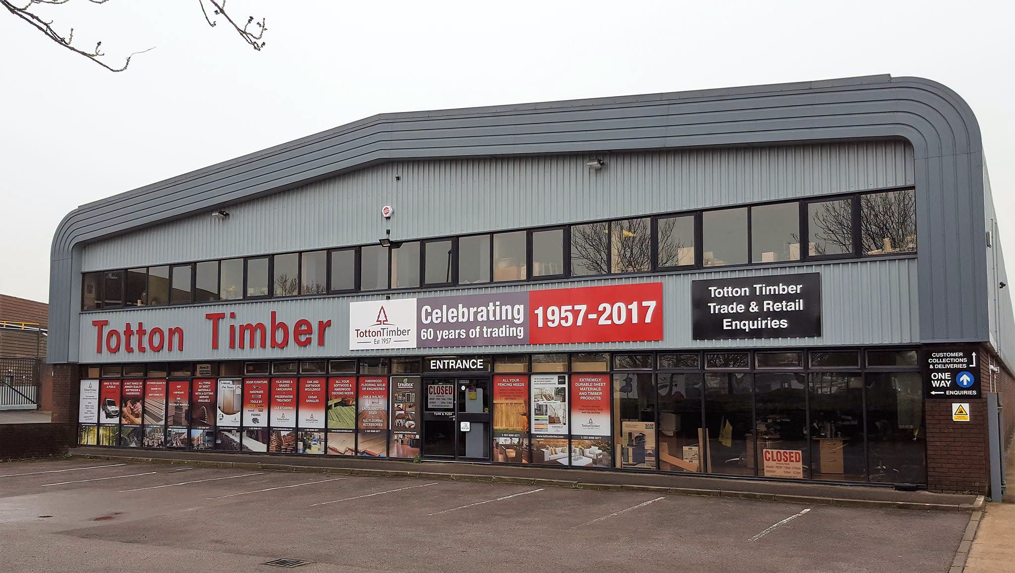 Totton Timber building with "Celebrating 1957-2017" banner, showing trade & retail entrance.